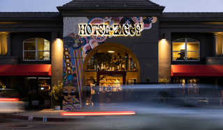 exterior of hotel ziggy with car passing on sunset boulevard