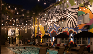 hotel ziggy pool with lights strung above