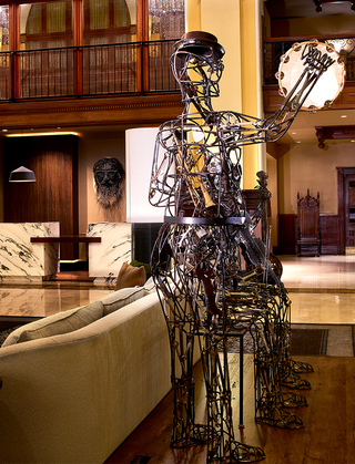 union station nashville metal statues of musicians playing the tambourine, violin, and banjo