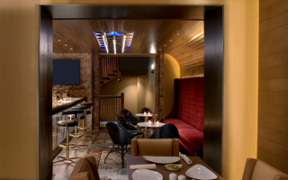 union station nashville small bar with black leather barstools and additional seating to the right of the bar