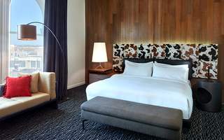union station nashville guestroom bed with a black and brown cow skin printed headboard