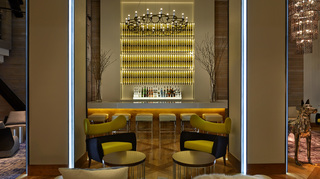 hotel zetta lobby featuring bar and seating
