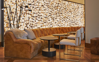 hotel zetta lobby leather couch and Alcatraz mural in the back