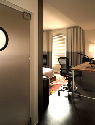 hotel zetta peak in to the guestroom from the hallway of the room