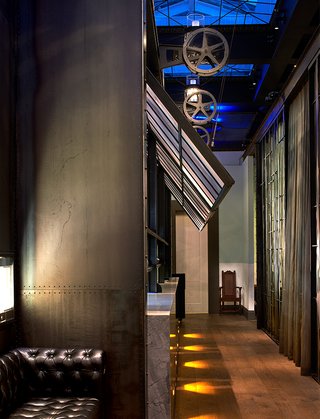 dirty habit dc hallway with foldup glass-stained aluminum windows facing the adjoined restaurant seating area