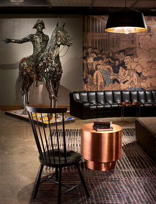 revere hotel metal sculpture of Paul Revere on a horse by artist Brian mock, located in the corner of the bar