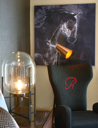 revere hotel guestroom mural of a horse sketched in white on a black canvas