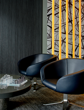 hotel zelos leather chairs and acrylic chess board on the table in the lobby