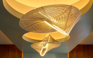 hotel zelos close up of elaborate wood chandelier in the lobby