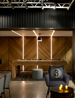 hotel palomar la game room with seating around the wooden pool table