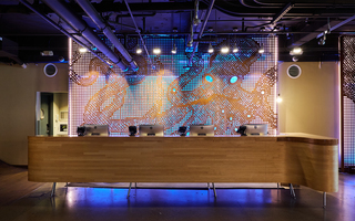 hotel zephyr lobby reception desk with the metal octopus mural