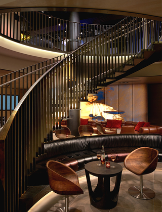 hotel vintage portland metal staircase going up from the lobby to the second-floor game room and lounge space