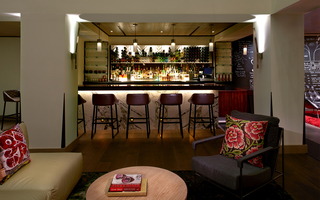 hotel vintage portland spacious lobby bar with wine bottles neatly displayed adjacent to the wine wall