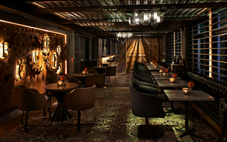 dirty habit sf 'bourbon' metal signage by the restaurant seating