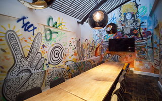 hotel zeppelin meeting room graffiti wall featuring the tv and conference table