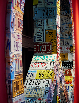 hotel zeppelin close up of the peace sign wall decorated with vintage license plates