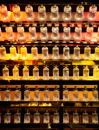 hotel zeppelin close up of liquor bottles displayed in the bar