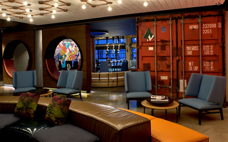 hotel zephyr lobby seating with a red crate wall in the background