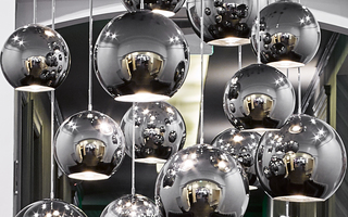 hotel zeppelin close up of the circular silver light fixtures hanging from the ceiling in the hallway