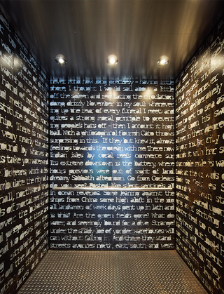 hotel zephyr elevator with a wallpaper of quotes from the novel Moby Dick